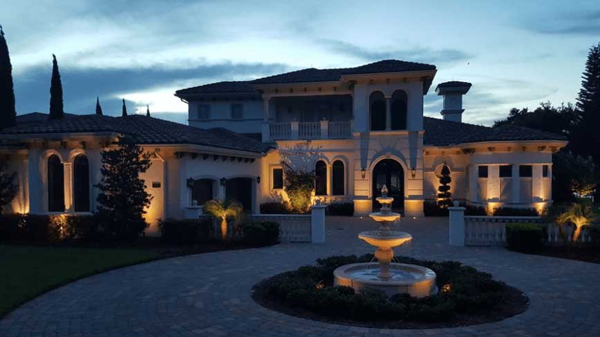 orlando landscape lighting installed on front of home and fountain